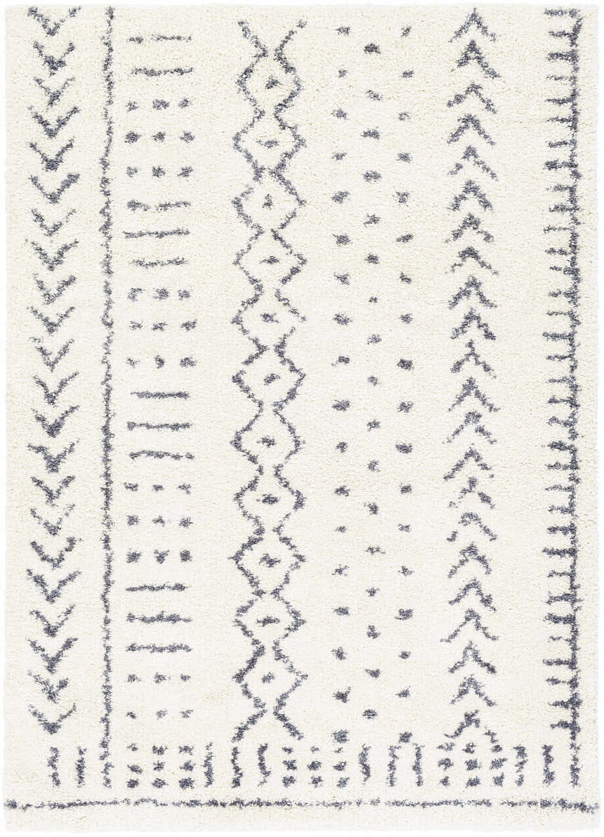 Close-up of the Wedowee Area Rug. White shag rug with gray bohemian-inspired geometric patterns. Design-Rectangle-5373