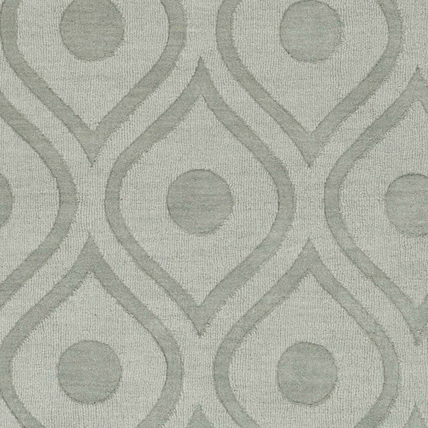 Close-up of the light gray Welaka Eye Pattern Wool Rug, featuring a geometric teardrop and dot design. Swatch