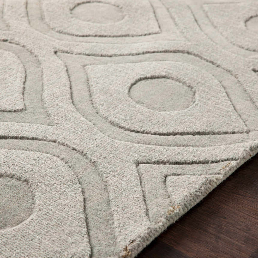 Close-up of the light gray Welaka Eye Pattern Wool Rug showing the textured, hand-loomed design. Texture