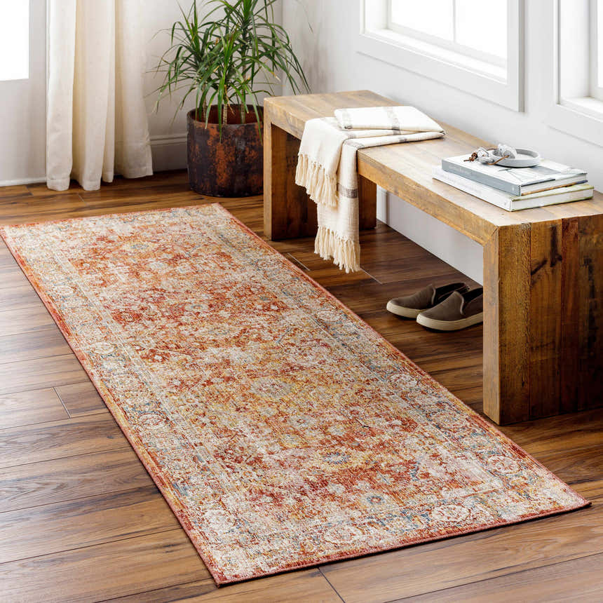 Entryway with a Wetaskiwin Area Rug runner in brick red and cream, wooden bench, and hardwood floors. Roomscene-Runner