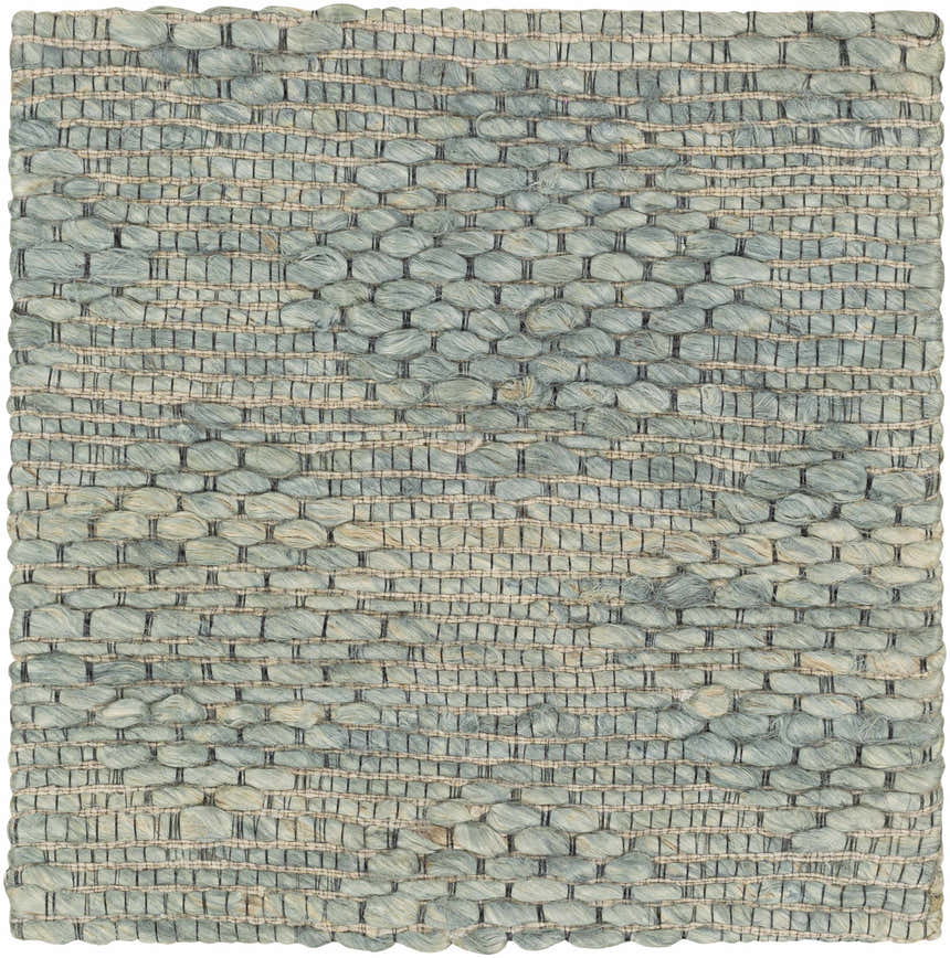 Close-up of the hand-woven Wishaw Sage Green Jute Rug. Features a textured, contemporary design in sage, brown, and jute tones. Swatch