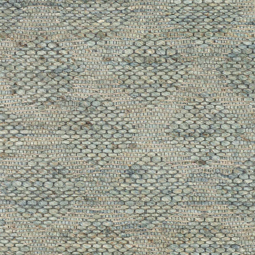 Close-up of the Wishaw Sage Green Jute Rug. Hand-woven texture in sage, green, and brown tones. Contemporary style. Swatch