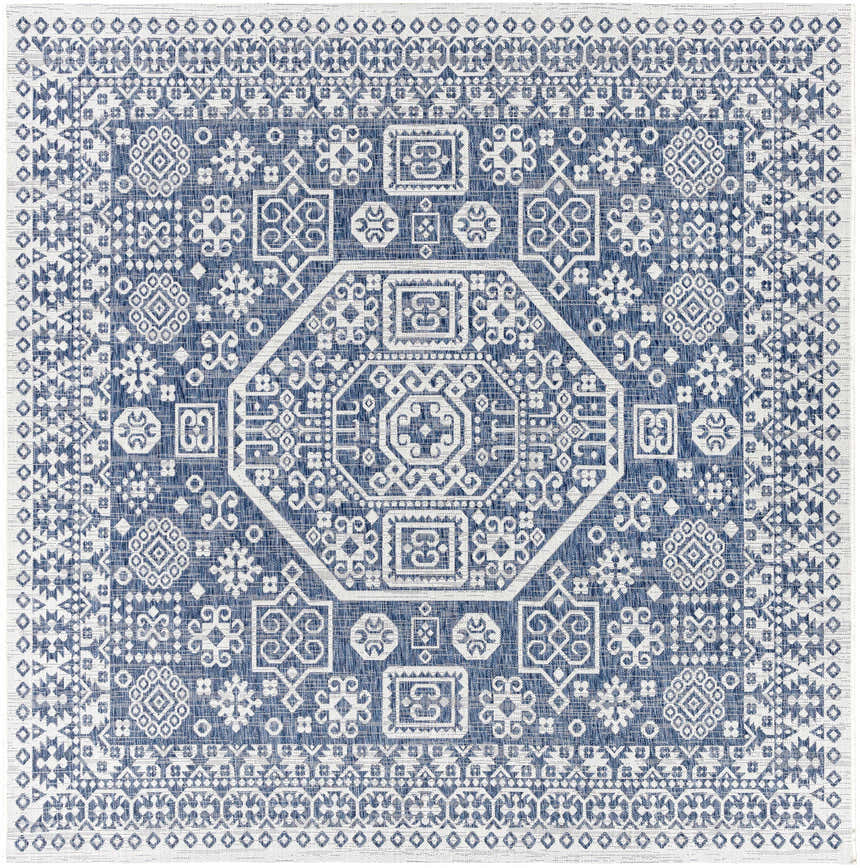 Close-up of the Windaroo Area Rug. Dark blue rug with off-white geometric, Bohemian-style pattern. Design-Square-710