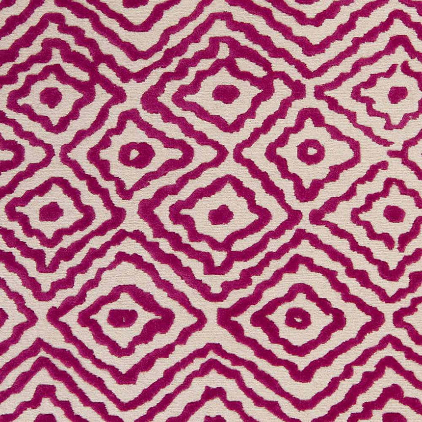 Close-up of Westhill Area Carpet. Hand-knotted wool rug with a fuchsia diamond pattern on a light beige background. Swatch