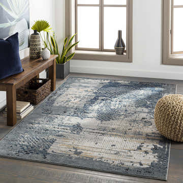 Living room scene with a blue and gray Waterboro Area Rug, wood bench, and natural light from windows. Roomscene-Rectangle