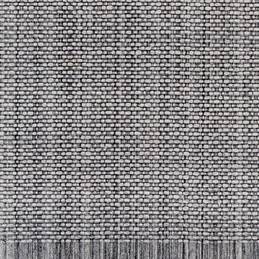 Close-up of a Hand Loomed Light Gray Area Rug. Woven texture in charcoal and cream recycled PET yarn. Swatch