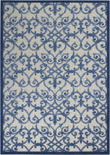 Close-up of the Nourison Aloha Grey Blue rug, showcasing its intricate blue scrollwork pattern on a gray background.