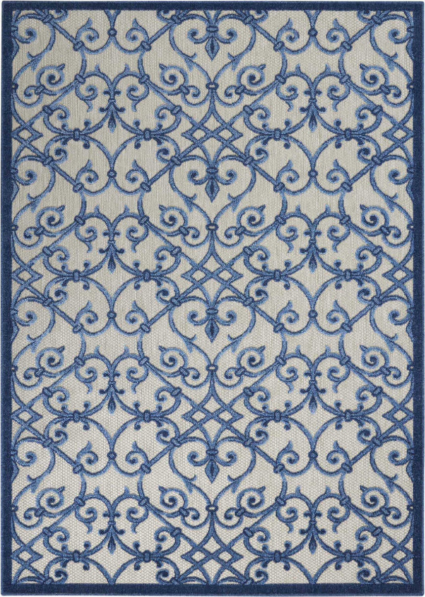 Close-up of the Nourison Aloha Grey Blue rug, showcasing its intricate blue scrollwork pattern on a gray background.