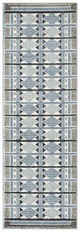 Close-up of Nourison Nordic Blue Modern rug. Light blue, gray, and black geometric pattern.