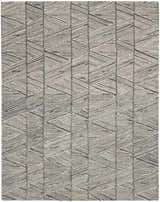 Close-up of the Nourison Colorado Grey White rug. Features a geometric pattern with gray and white hues. Handmade wool and cotton texture.