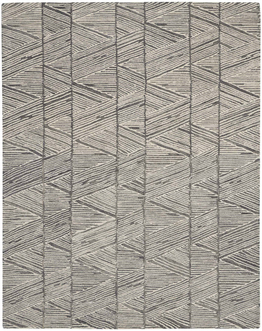 Close-up of the Nourison Colorado Grey White rug. Features a geometric pattern with gray and white hues. Handmade wool and cotton texture.