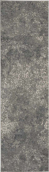 Close-up of the Michael Amini MA90 Uptown Grey rug. Modern design with gray tones and subtle, abstract patterns.