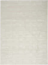 Close-up of the Nourison Dew Beige Rug, a low pile, machine-made rug with a subtle geometric pattern.