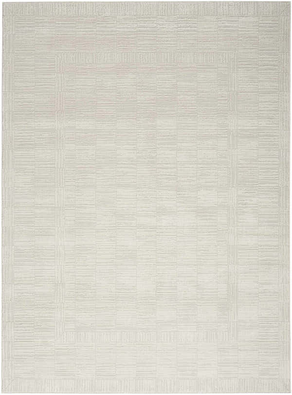 Close-up of the Nourison Dew Beige Rug, a low pile, machine-made rug with a subtle geometric pattern.