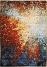 Close-up of Nourison Chroma Red Flare rug. Abstract design in red, blue, and cream hues. Mid-century modern style.