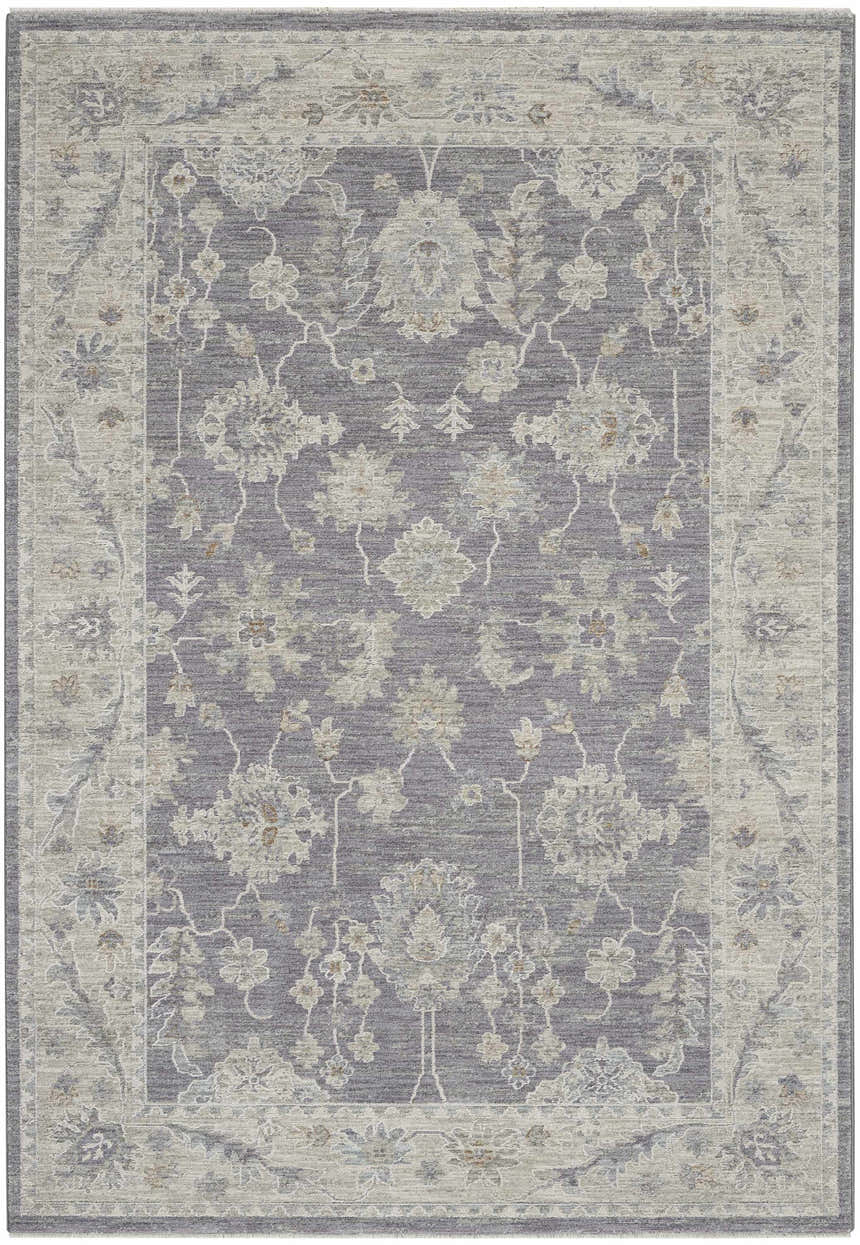 Close-up of Nourison Infinite Charcoal Vintage Indoor Area Rug with taupe floral pattern and a distressed vintage style.