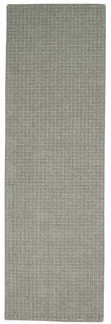 Close-up of the Calvin Klein Las Vegas Grey Retro Rug. The wool rug has a subtle, textured grid pattern.