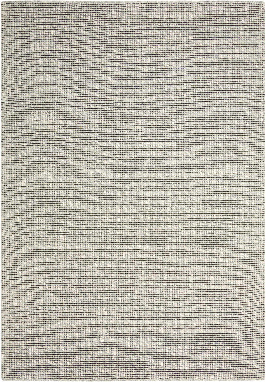 Close-up of the Calvin Klein Home Lowland Basalt rug. Handmade wool rug with a textured, horizontal striped design.