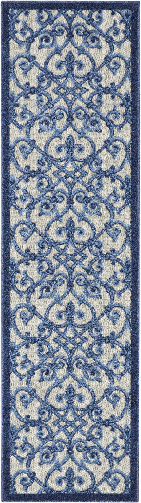 Close-up of the Nourison Aloha Grey Blue Contemporary Area Rug, featuring a blue floral scroll pattern on a gray textured background.