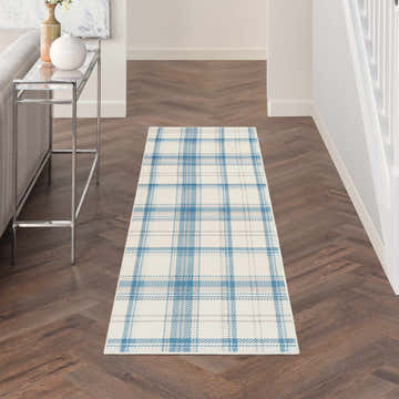Hallway with Nourison Grafix Ivory Blue Farmhouse Indoor Area Rug runner on dark wood floors. Plaid design.
