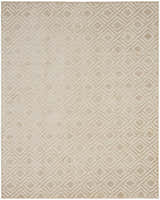 Close-up of the Nourison Care Free Beige rug featuring a subtle, geometric diamond pattern. Mid-century modern style.