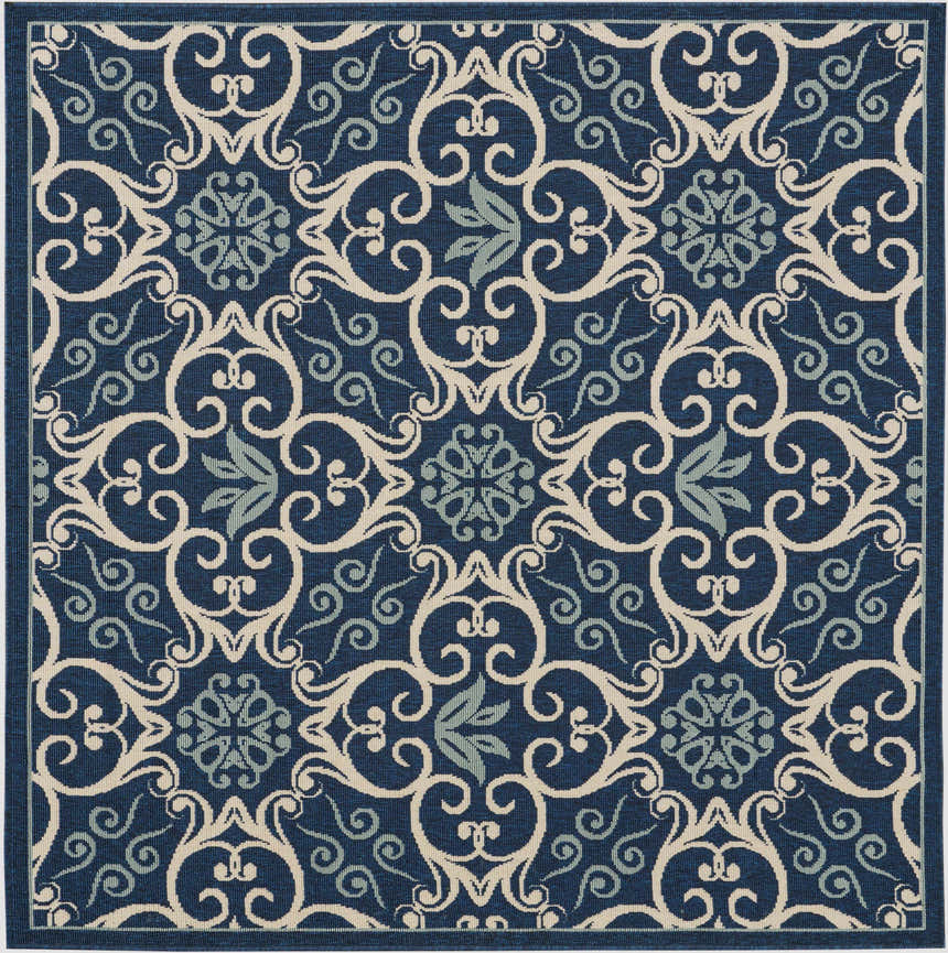 Close up of Nourison Caribbean Navy Contemporary Area Rug with floral and scroll pattern.