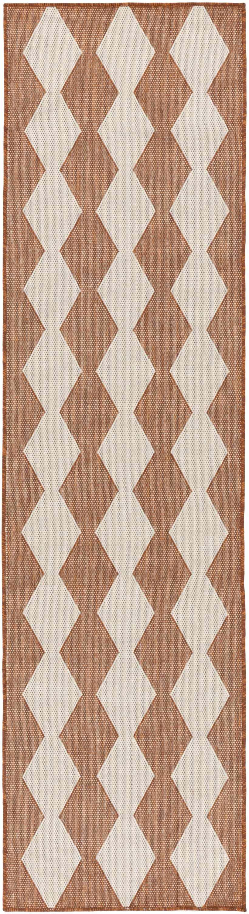 Close-up of Nourison Positano Terracotta Rug. Burnt orange with a geometric diamond pattern. Mid-Century Modern style.