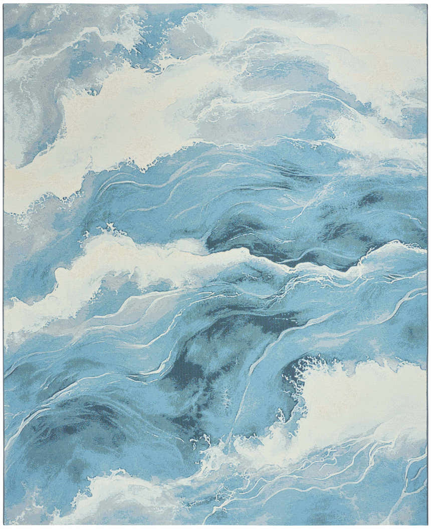 Close-up of the Nourison Color Splash Ivory Blue Area Rug, featuring a coastal wave pattern in shades of blue, gray, and white.