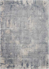 Close-up of the Nourison Rustic Textures Grey Beige rug. Modern design with distressed gray, beige, and subtle texture.