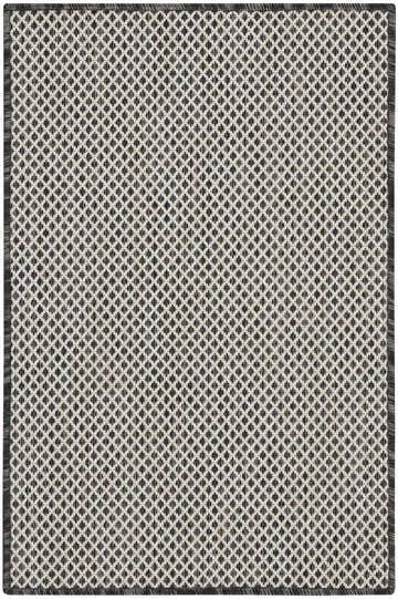 Close-up of the Nourison Courtyard Ivory Charcoal rug, featuring a diamond pattern and textured weave.