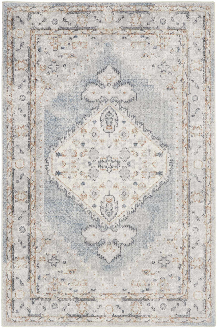 Close-up of Nourison Astra Light Blue Vintage Washable Area Rug. Features a traditional, distressed pattern.