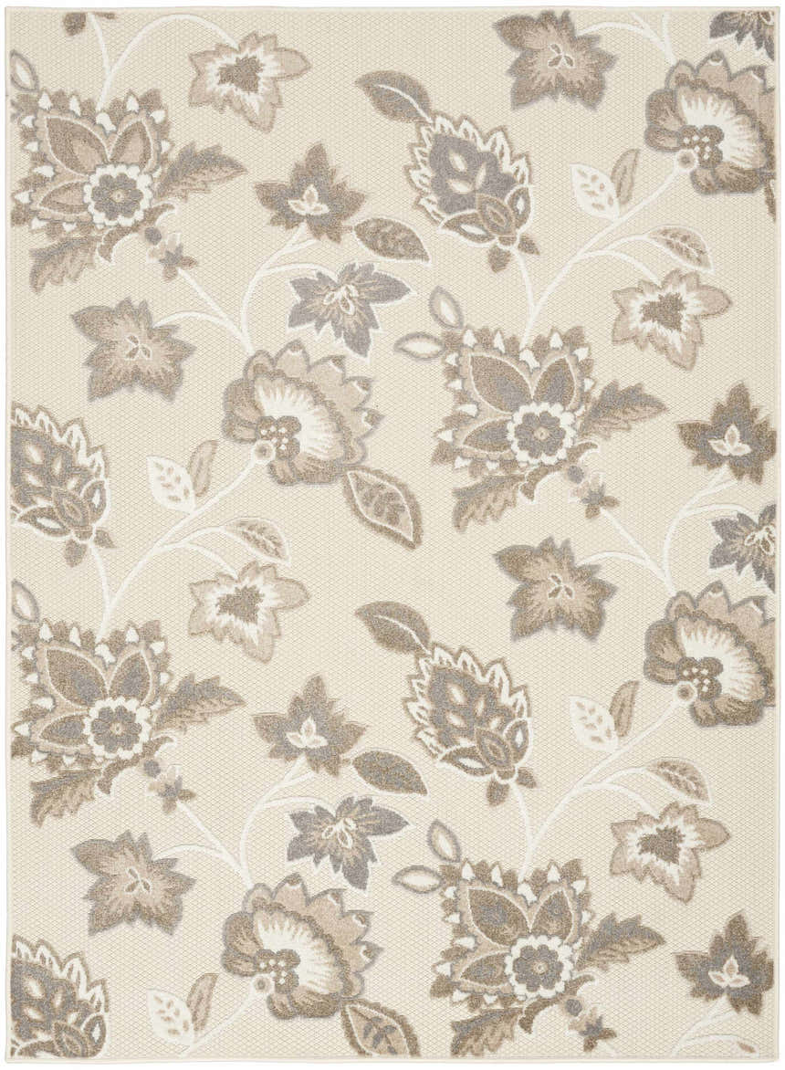 Close-up of the Nourison Aloha Beige Farmhouse Area Rug featuring a floral pattern in beige, brown, and gray hues.