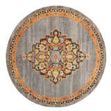Close-up of a round Nourison Passionate Grey Bohemian Area Rug featuring a colorful floral medallion pattern.
