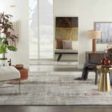 Living room scene with a Nourison Tangra Multicolor rug, neutral furniture, and modern decor.