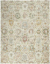 Close-up of Nourison Twilight Ivory Multicolor Transitional Area Rug featuring a floral pattern in chestnut, gold, green, and gray.