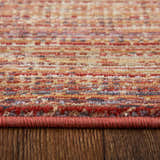 Close-up of Feizy Deja Modern Solid rug showing brown, red, and tan colors and textured weave. Pile