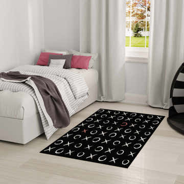Kids bedroom with a Nourison Imagination Black rug featuring a white and red tic-tac-toe design.