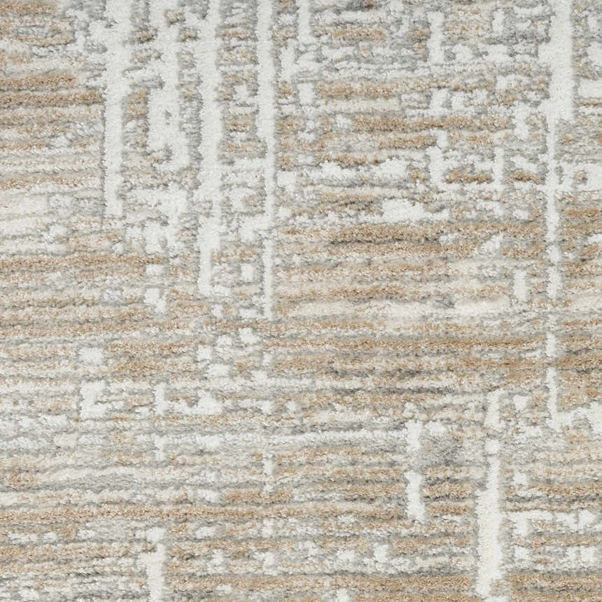Close-up of the Nourison Home Texture Beige Grey rug, showing its abstract pattern and soft, textured pile.