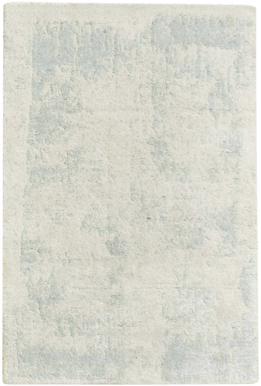 Close-up of the Nourison Harmony Ivory Aqua rug showing its soft texture and abstract, watercolor-like blue pattern.