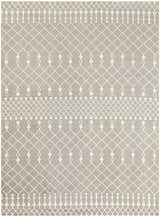 Close-up of Nourison Astra Sage Bohemian Rug. Muted sage rug with white geometric diamond and tassel pattern. Machine made texture.