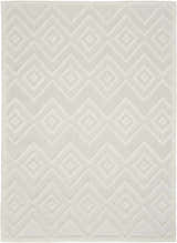 Close-up of the Nourison Versatile Ivory White Area Rug featuring a geometric diamond and zig-zag pattern.