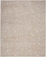 Close-up of the Nourison Grafix Beige Area Rug featuring a delicate white floral vine pattern.