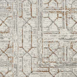 Close-up of Nourison Desire Ivory Beige Rug. Geometric pattern in ivory, beige, and gray hues. Soft, textured pile.