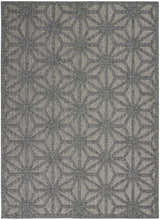 Close-up of the Nourison Cozumel Dark Grey Modern Area Rug, featuring a geometric starburst pattern and textured weave.