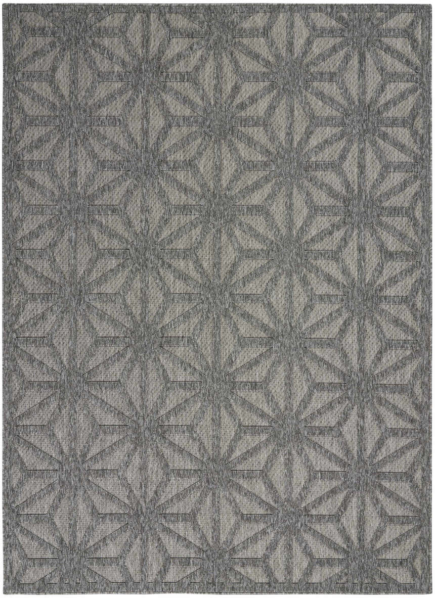 Close-up of the Nourison Cozumel Dark Grey Modern Area Rug, featuring a geometric starburst pattern and textured weave.