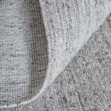 Close-up of the hand-knotted Feizy Finley Silver Area Rug showing texture and silver gray color. Fold
