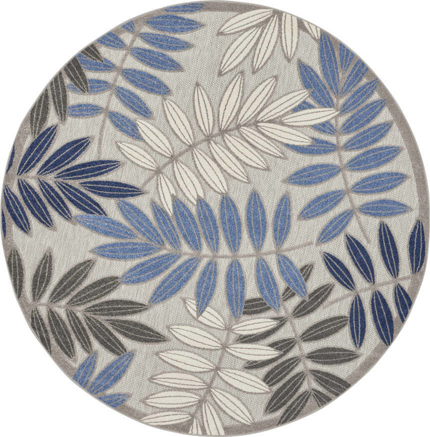 Close-up of a round Nourison Aloha Grey Blue Tropical Area Rug with a leaf pattern in blue, gray, and white.