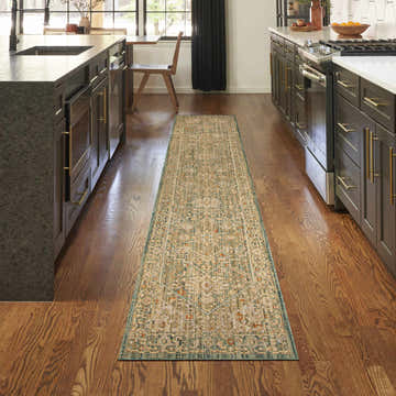 Modern kitchen with a Nourison Antique Bloom Teal vintage runner rug on hardwood floors.