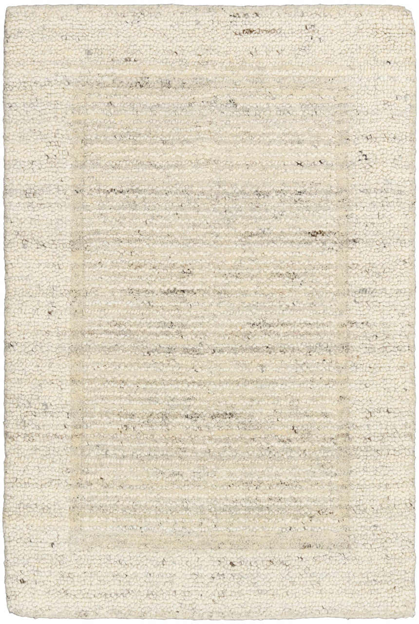 Close-up of the Calvin Klein CK082 Ridge Ivory rug. Handmade wool rug with chestnut accents and a farmhouse style.