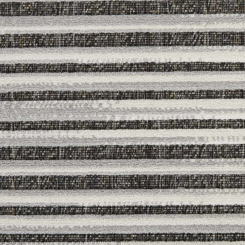 Close-up of the textured Nourison Key Largo Dark Grey rug featuring a contemporary striped pattern in gray, charcoal, and white.